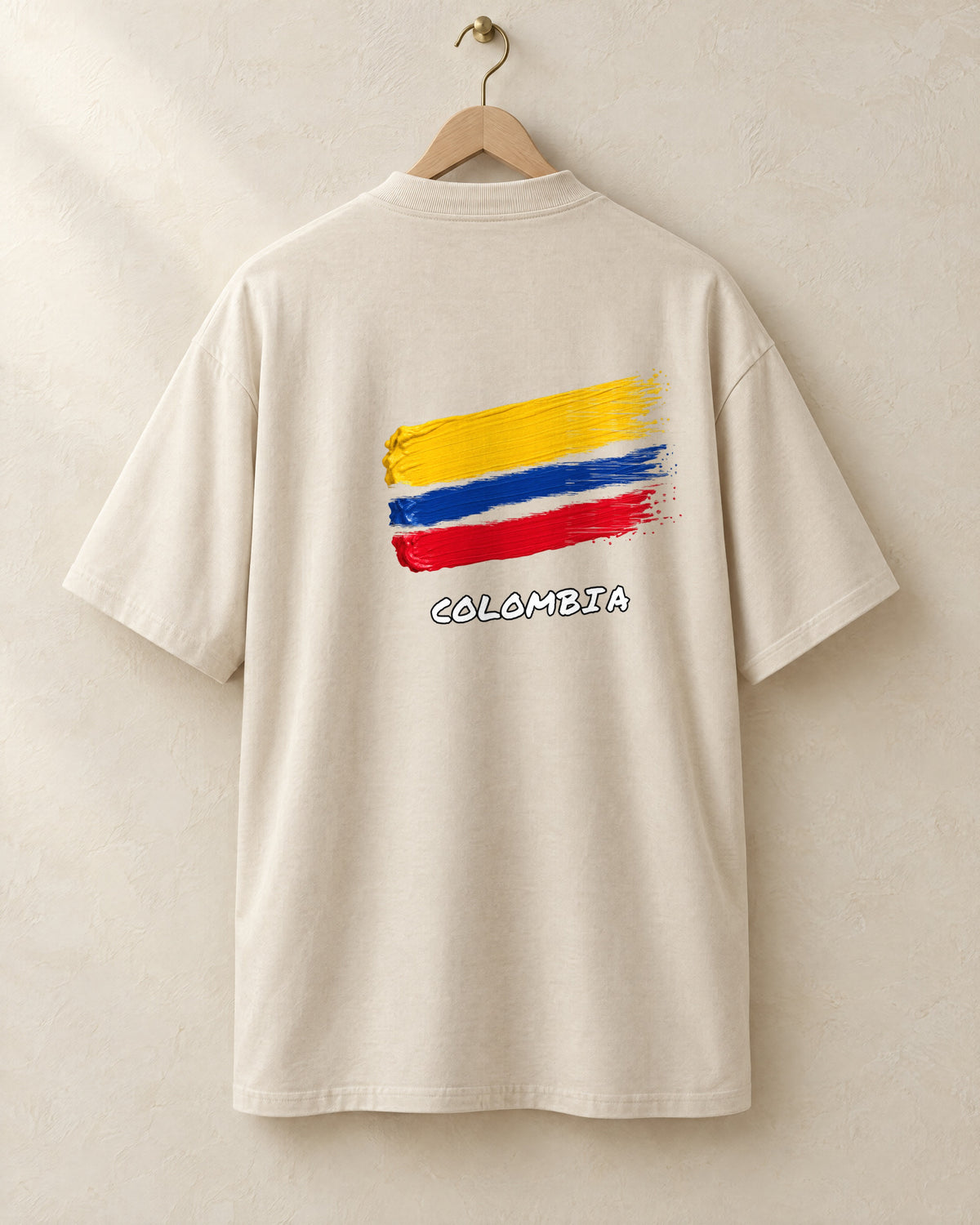 Bandera tee in cream, back, on a hanger