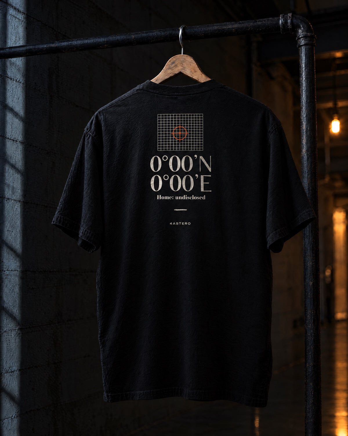 Null Island back print on a black 4ASTERO heavyweight tee, on a hanger