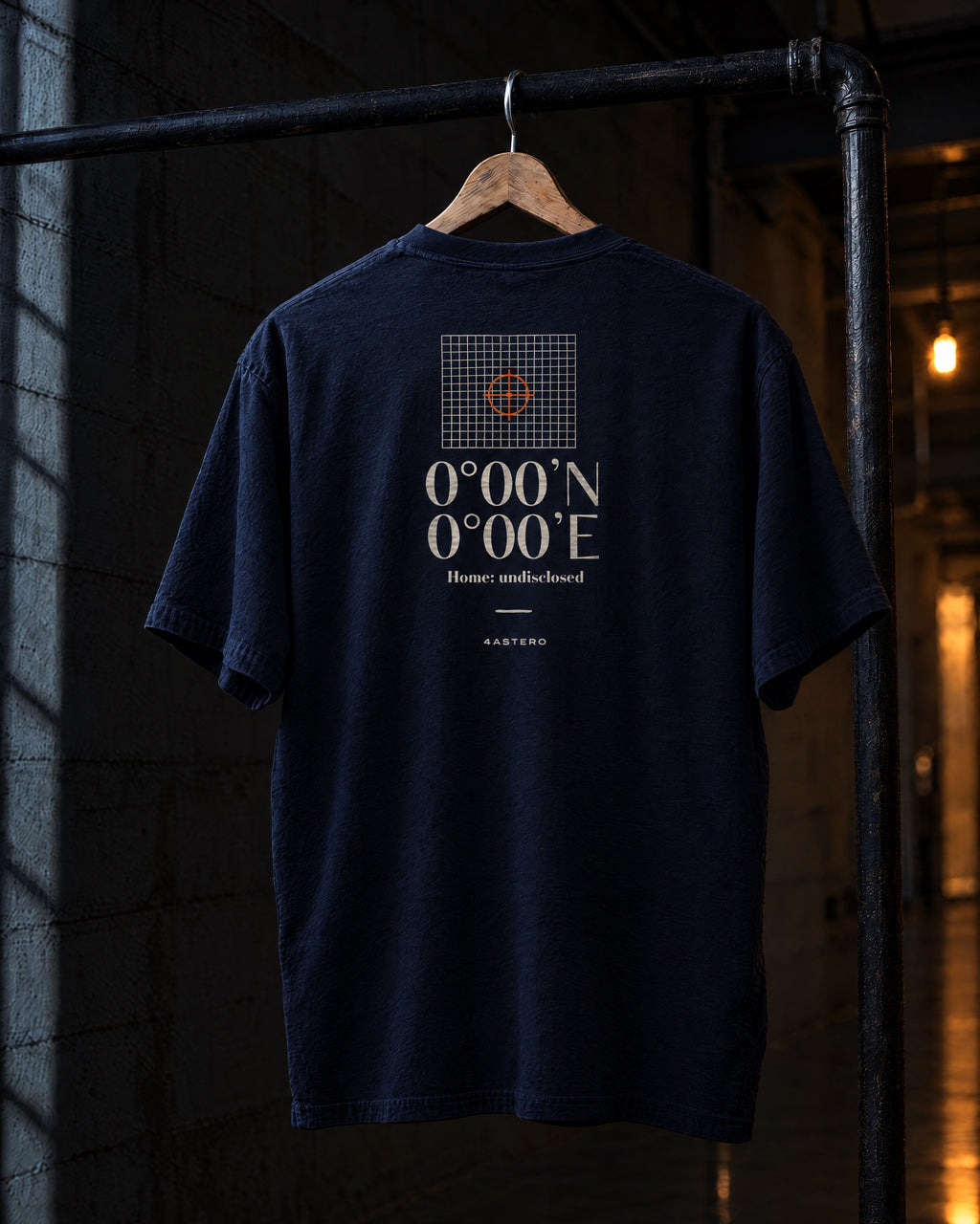 Null Island back print on a navy 4ASTERO heavyweight tee, on a hanger