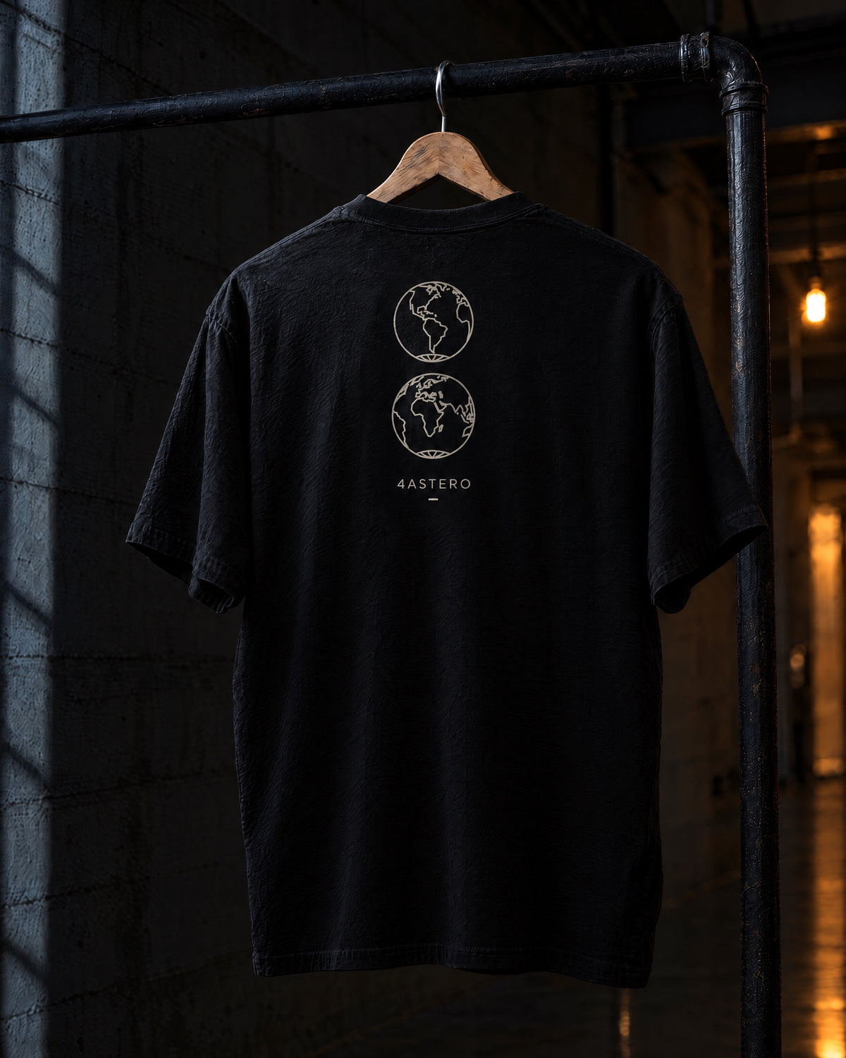 Borderless back print on a black 4ASTERO heavyweight tee, on a hanger