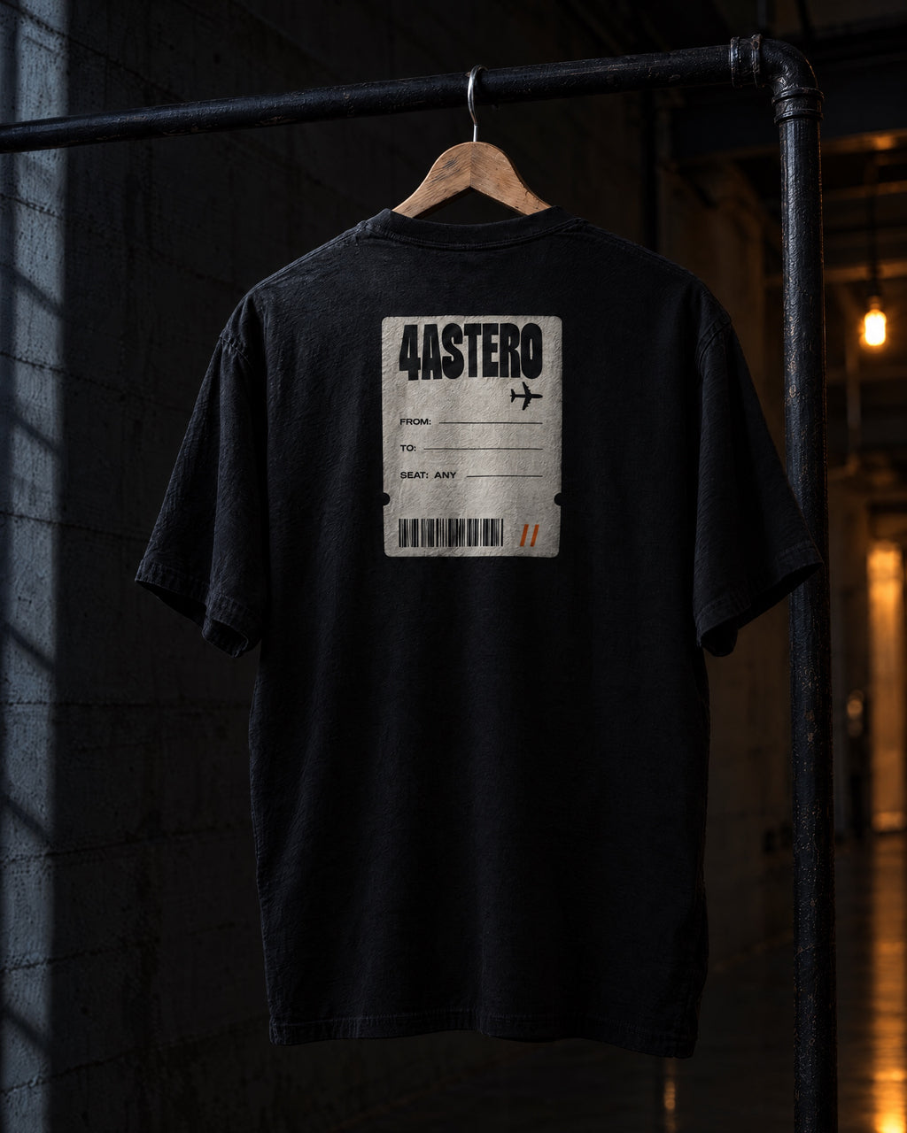 Boarding Pass back print on a black 4ASTERO heavyweight tee, on a hanger