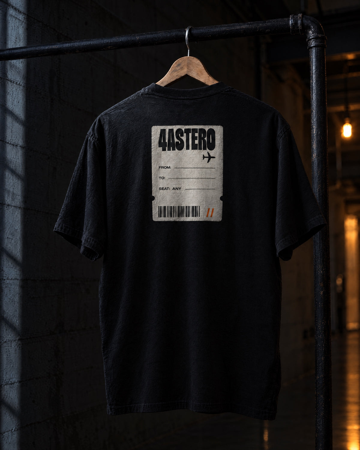 Boarding Pass back print on a black 4ASTERO heavyweight tee, on a hanger