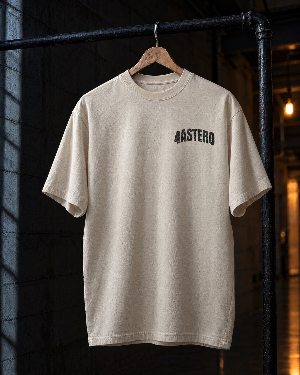 Front of the natural 4ASTERO heavyweight tee with the small chest logo, on a hanger