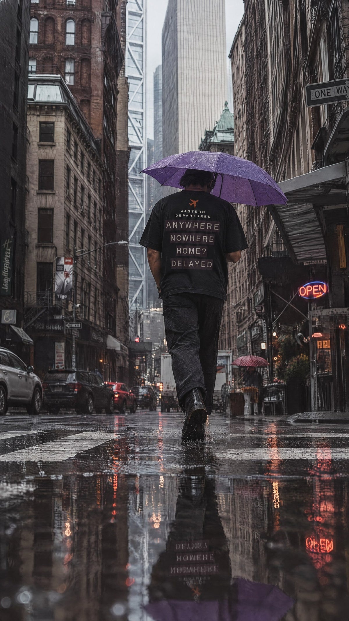 Departures back print on a black 4ASTERO heavyweight tee, rainy street