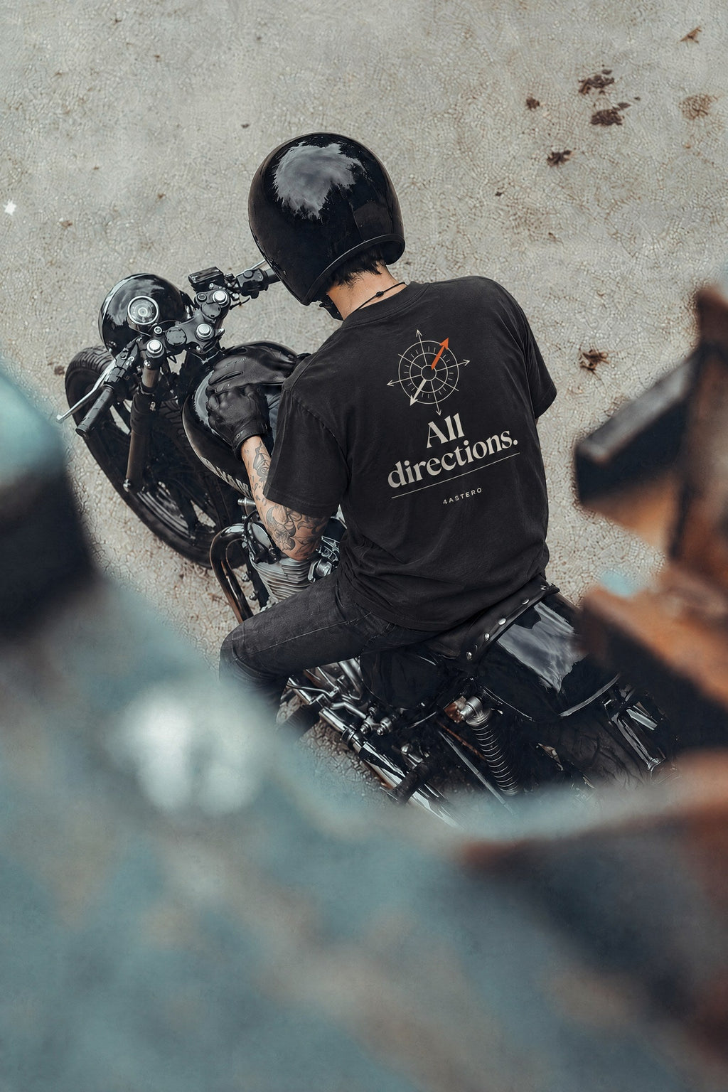 Rider on a motorcycle wearing the black All Directions tee