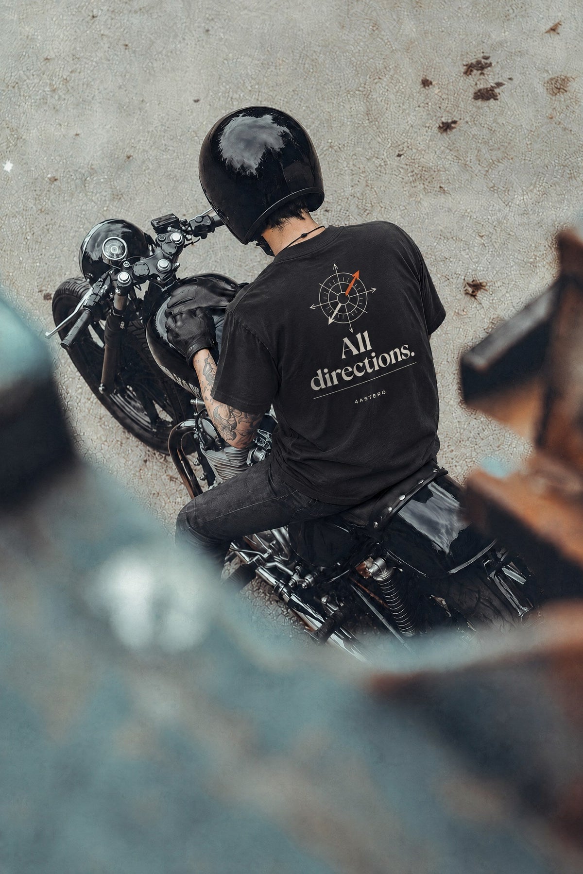 Rider on a motorcycle wearing the black All Directions tee