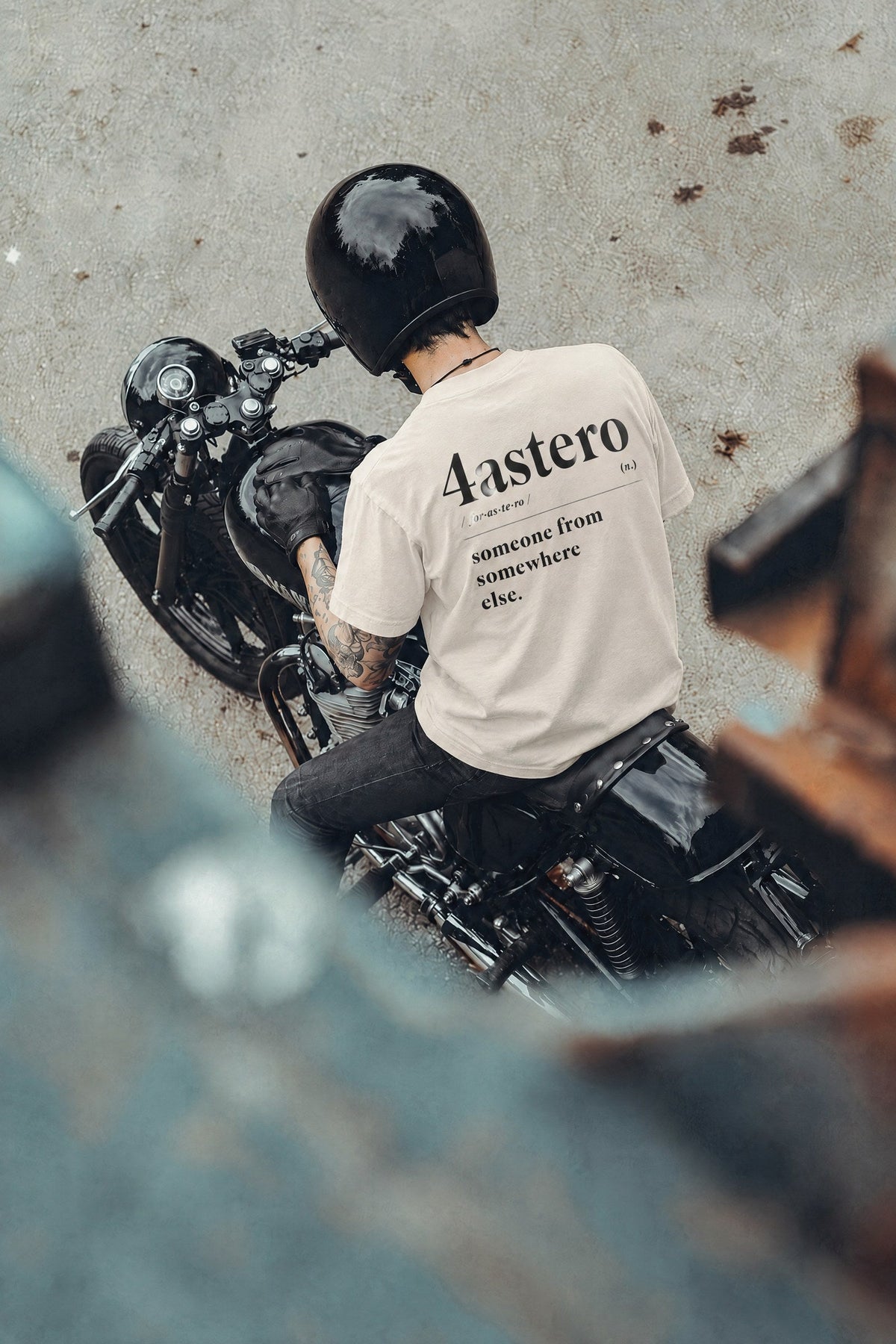 Rider on a motorcycle wearing the natural Dictionary tee
