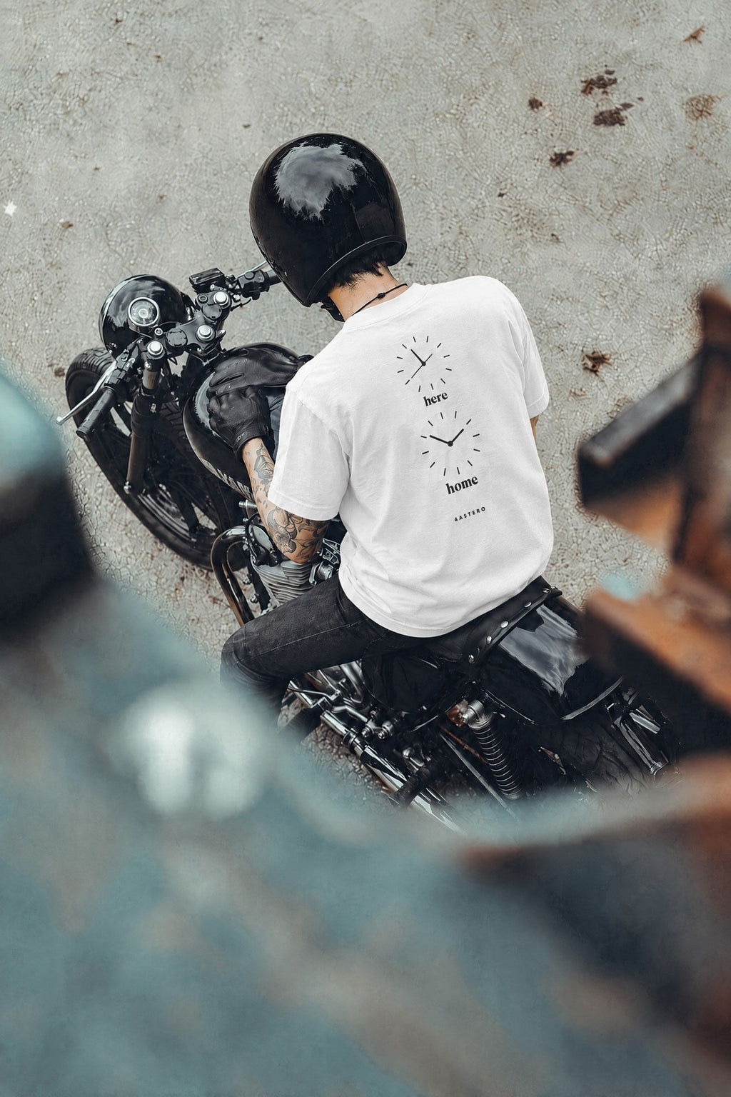 Rider on a motorcycle wearing the white Here / Home tee