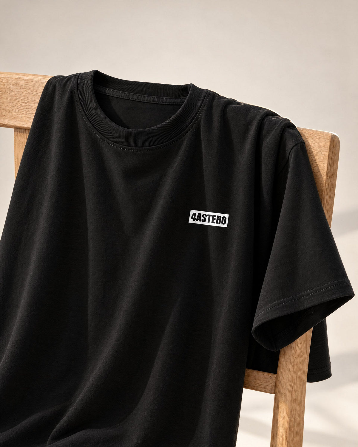 Front of the black 4ASTERO heavyweight tee with the small chest logo
