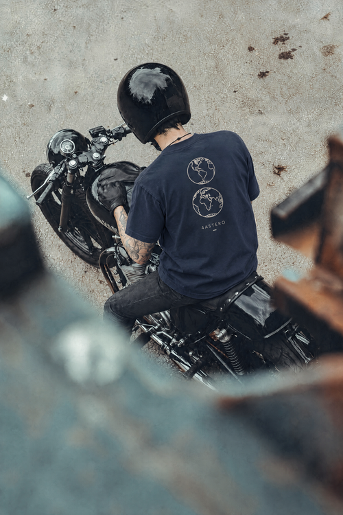 Rider on a motorcycle wearing the navy Borderless tee