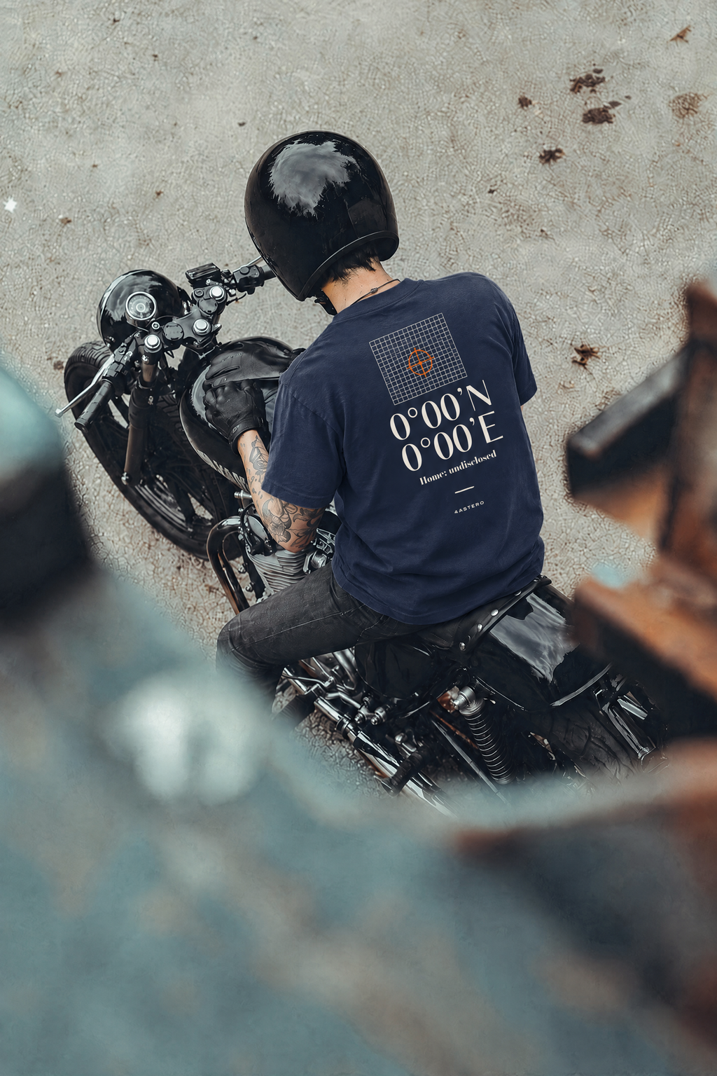 Rider on a motorcycle wearing the navy Null Island tee